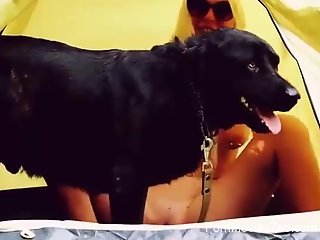 Nude blonde fucks with her dog while out camping